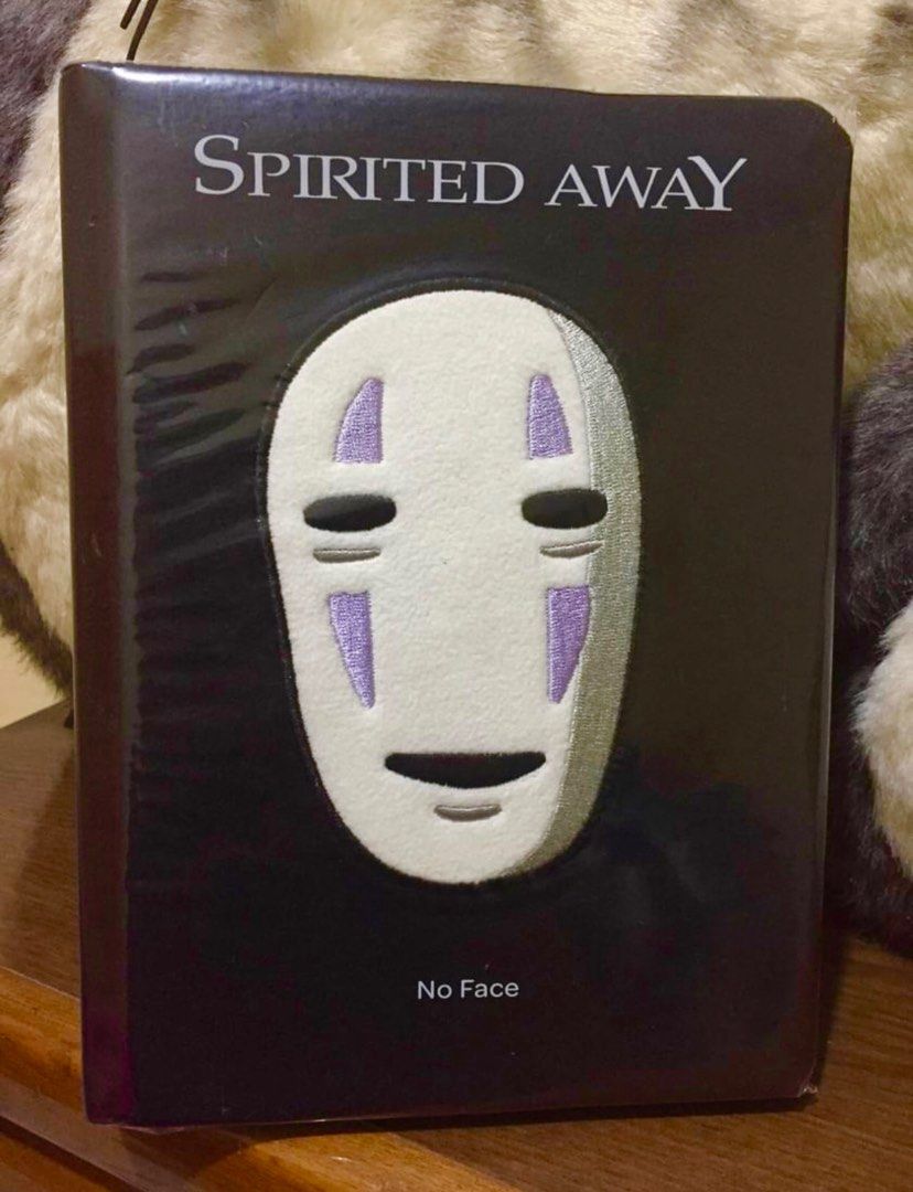 Spirited Away No Face Journal (Category: Comics & Manga) located in Apalit. Submitted by gudeshak (Listing ID 1332662179, Image 1). Description: A plush-wrapped hardcover with embroidered details, full-color artwork on the front and back pages, plus 1-color spot illustrations throughout the lined interior. Bought in Ghibli Park Japan. Brand new and the covers still wrapped with plastic film..
