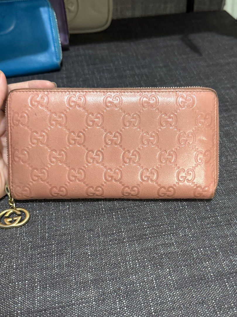 Authentic GUCCI long wallet (Category: Luxury Bags & Wallets) located in Dagupan City. Submitted by luckyluxbyemgee (Listing ID 1332813422, Image 1). Description: Auth GUCCI GG Guccissima Leather Round Zipper Bifold Long Wallet Purse Pink - Guaranteed moneyback if fake Selling Low‼️ with few color fading, scratches and sign of use zipper all working no problem/no holes/ no bad smell Legit photos no edits- real condition of item If need more detai