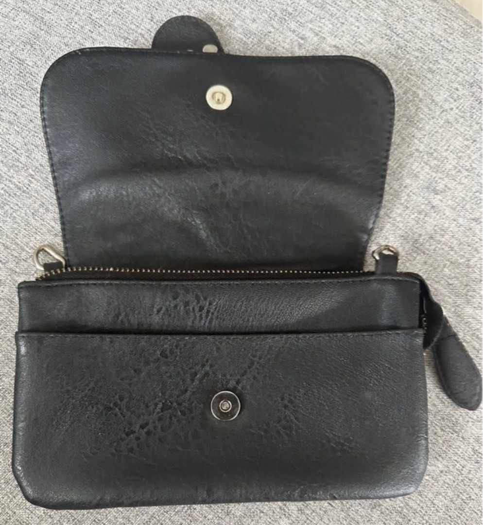 Black studded clutch (Category: Luxury Bags & Wallets) located in Manila. Submitted by bornthisway22 (Listing ID 1332806761, Image 2). Description: black purse with stud super nice in actual japan bought actual picture posted Can be use as wallet and mini sling bag too.