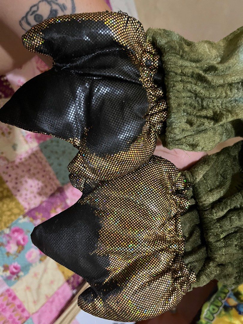 Dinosaur Costume (Category: Babies & Kids Fashion) located in San Fernando. Submitted by InvisibleMe (Listing ID 1332822061, Image 3). Description: Faded on gold parts Have small hoes Please see photos for flaws 5-7 .
