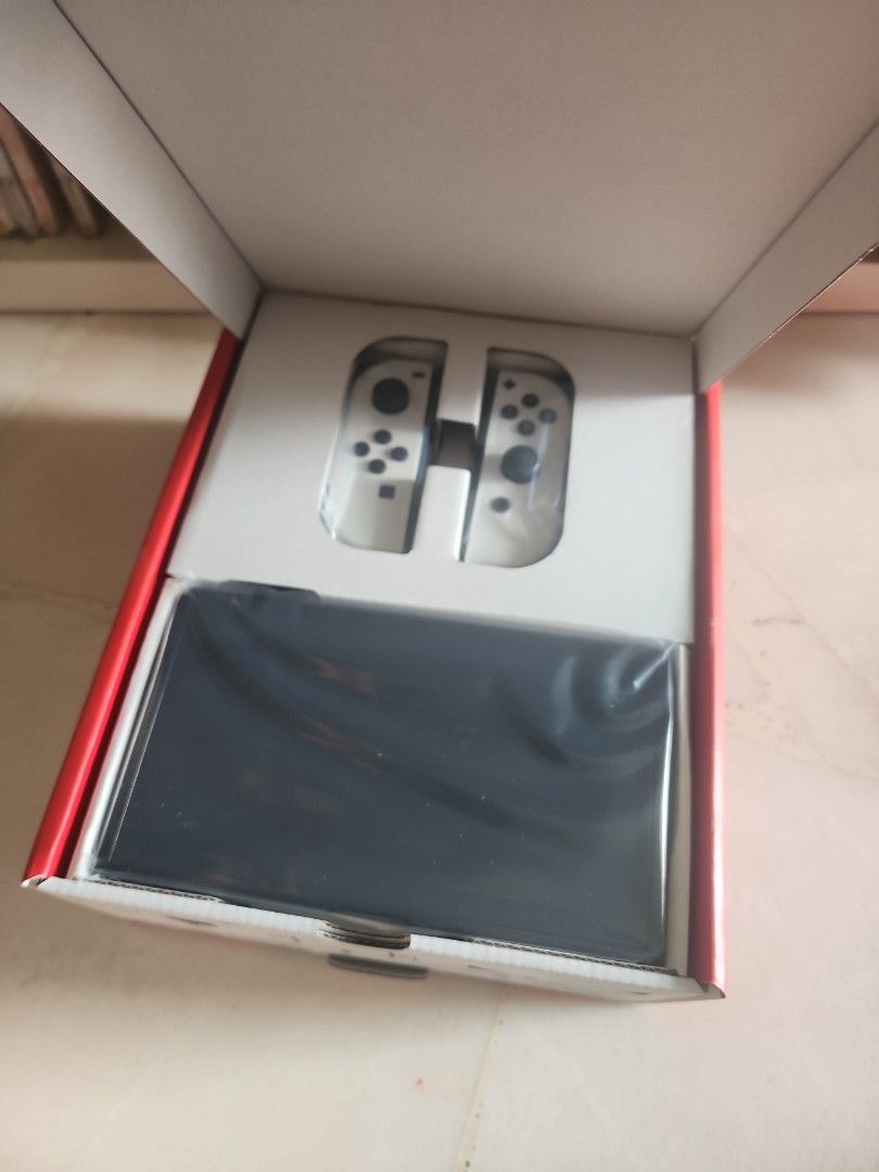 Nintendo Switch Oled (Category: Nintendo) located in Singapore. Submitted by beanster82 (Listing ID 1332815421, Image 2). Description: Brand New in Box gift from re-subscription, am not using it since mid of the year, so i want to sell it. 64gb system memory, 7 inch screen, adjustable stand. self collect at cwealth/qtown area..