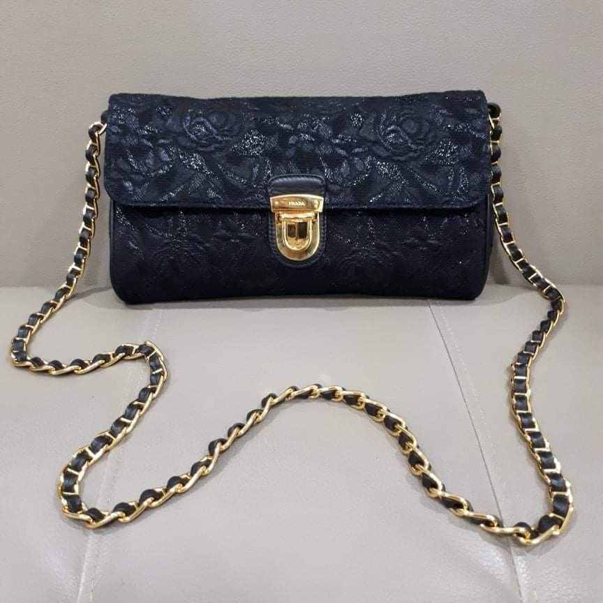 Prada Pattina Tessuto Lurex Nero (Category: Luxury Bags & Wallets) located in Taguig. Submitted by esa.agustin (Listing ID 1332859369, Image 1). Description: Original Prada Pattina Lurex Nero chain sling bag. Complete inclusion (box, dust bag, carecard and authenticity card). Gold chain and hardware. Made in Italy..