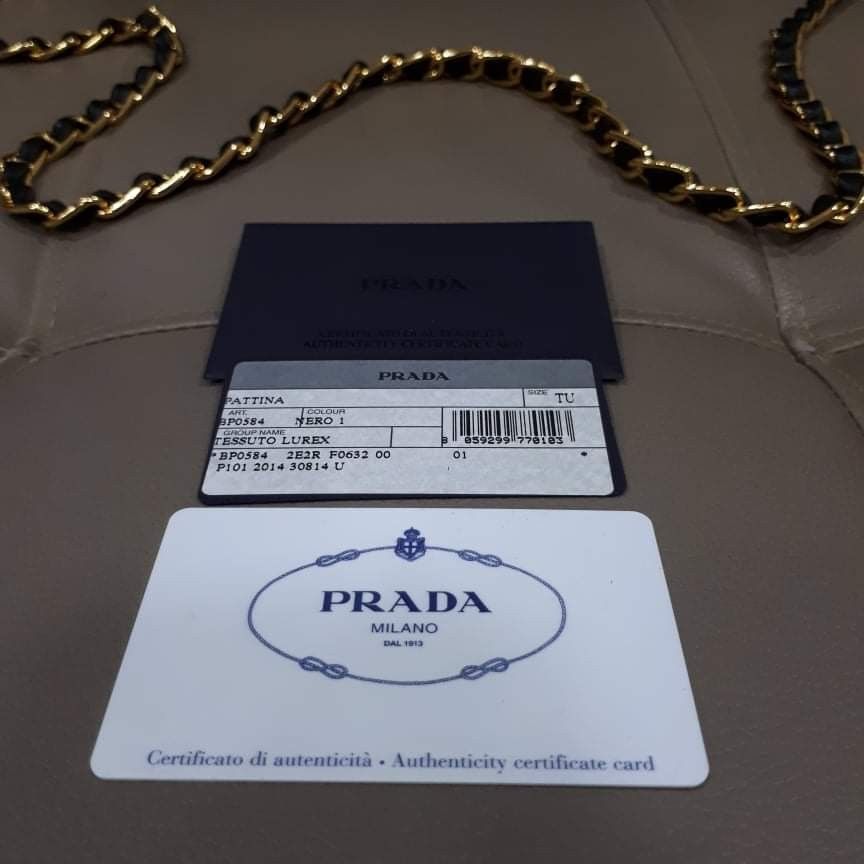 Prada Pattina Tessuto Lurex Nero (Category: Luxury Bags & Wallets) located in Taguig. Submitted by esa.agustin (Listing ID 1332859369, Image 3). Description: Original Prada Pattina Lurex Nero chain sling bag. Complete inclusion (box, dust bag, carecard and authenticity card). Gold chain and hardware. Made in Italy..