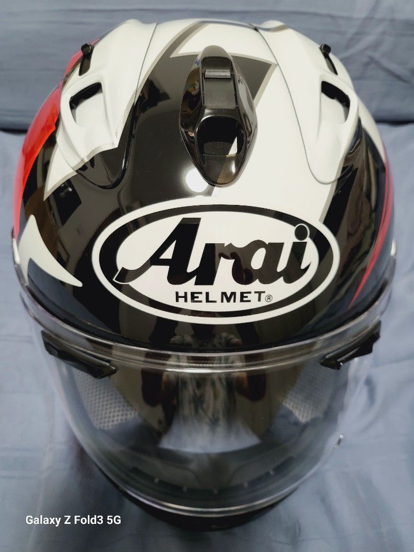 Arai Full face helmet (Category: Motorcycle Accessories) located in Singapore. Submitted by matthiazzhang (Listing ID 1332986460, Image 2). Description: medium size wore twice dents and stretches free helmet bag nett price..