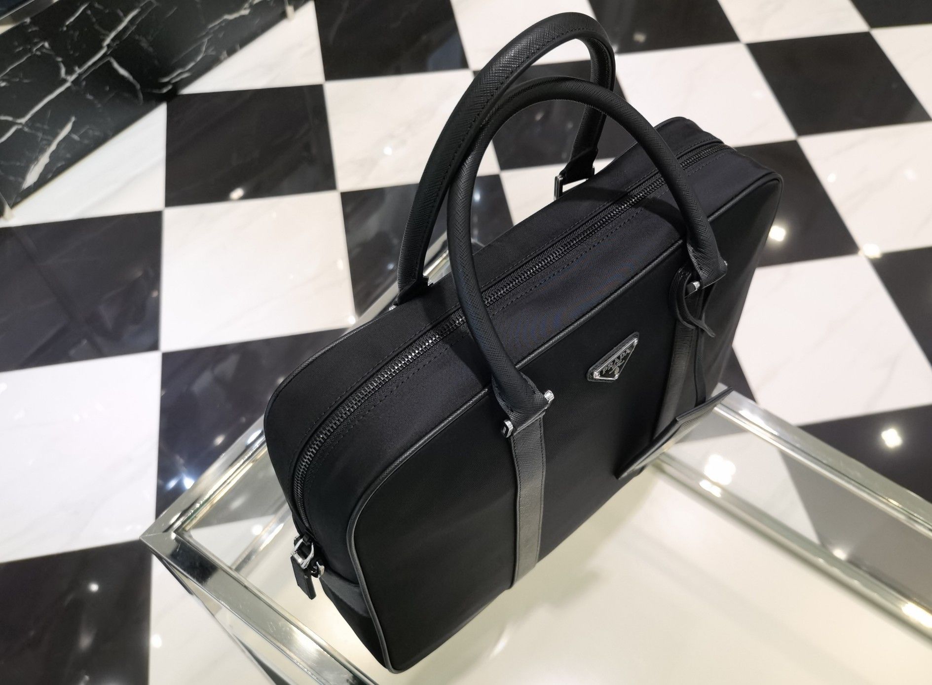 Authentic prada classic nylon briefcase handbag (Category: Bags & Wallets) located in Singapore. Submitted by luxurycloset.shop (Listing ID 1333133030, Image 2). Description: Brand new and authentic Mail included Deal via courier delivery Size: Width 36x Height 28x Bottom 8cm.