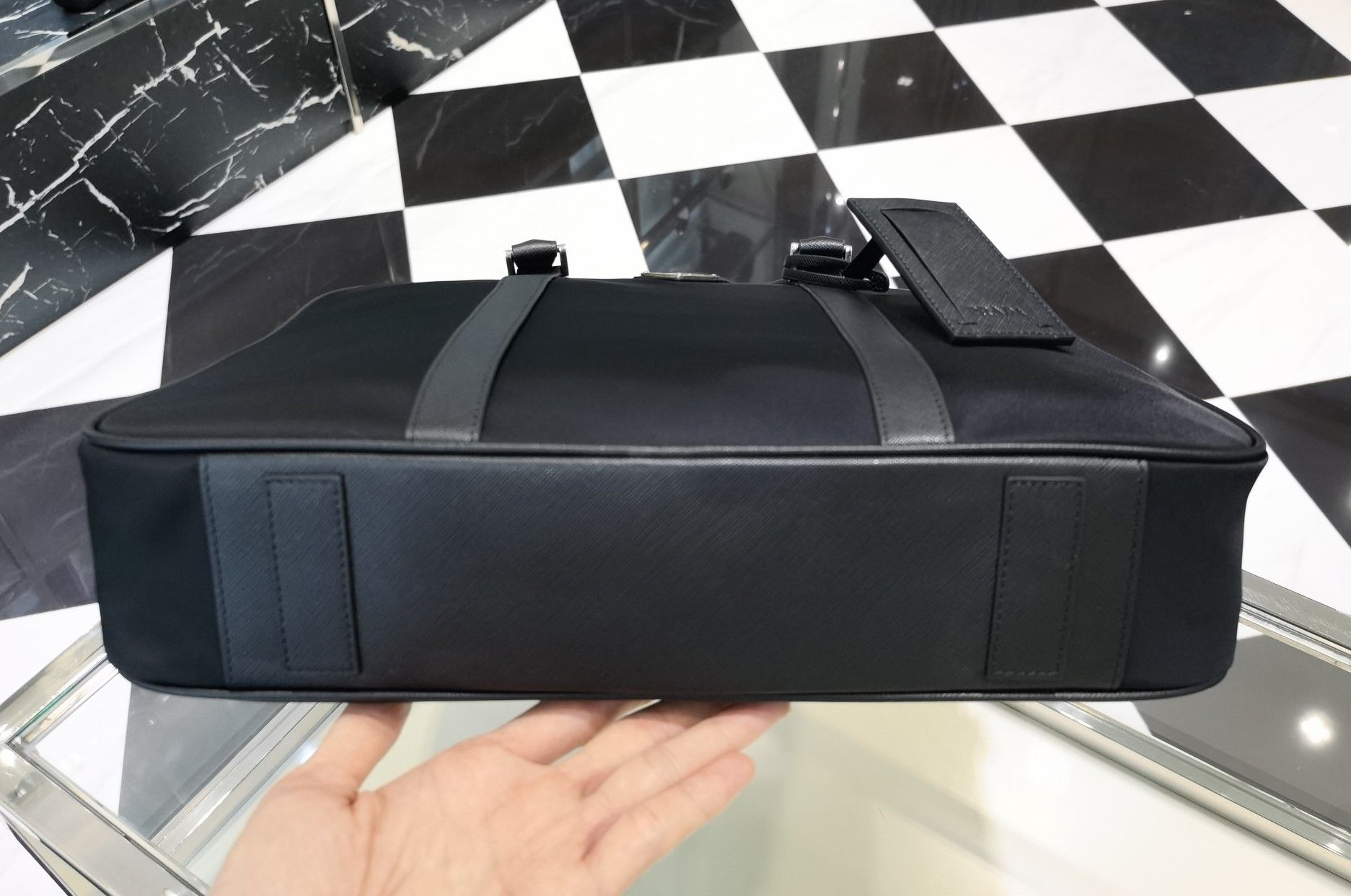 Authentic prada classic nylon briefcase handbag (Category: Bags & Wallets) located in Singapore. Submitted by luxurycloset.shop (Listing ID 1333133030, Image 3). Description: Brand new and authentic Mail included Deal via courier delivery Size: Width 36x Height 28x Bottom 8cm.