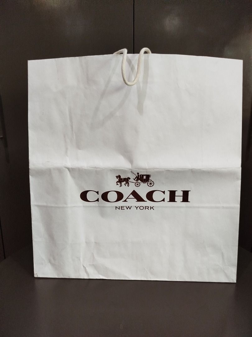 Coach paper bag XL (Category: Luxury Bags & Wallets) located in Valenzuela. Submitted by cletini (Listing ID 1333090873, Image 2). Description: There is dirt stain at the bottom and was folded when stored. WYSIWYG Please manage expectations. Posted issues also and size. Item location: Valenzuela 241027 MRWI .