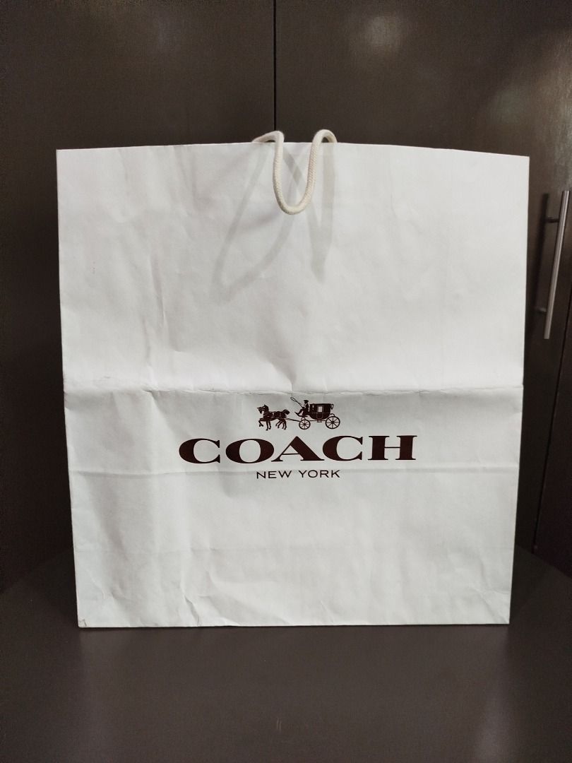 Coach paper bag XL (Category: Luxury Bags & Wallets) located in Valenzuela. Submitted by cletini (Listing ID 1333090873, Image 1). Description: There is dirt stain at the bottom and was folded when stored. WYSIWYG Please manage expectations. Posted issues also and size. Item location: Valenzuela 241027 MRWI .