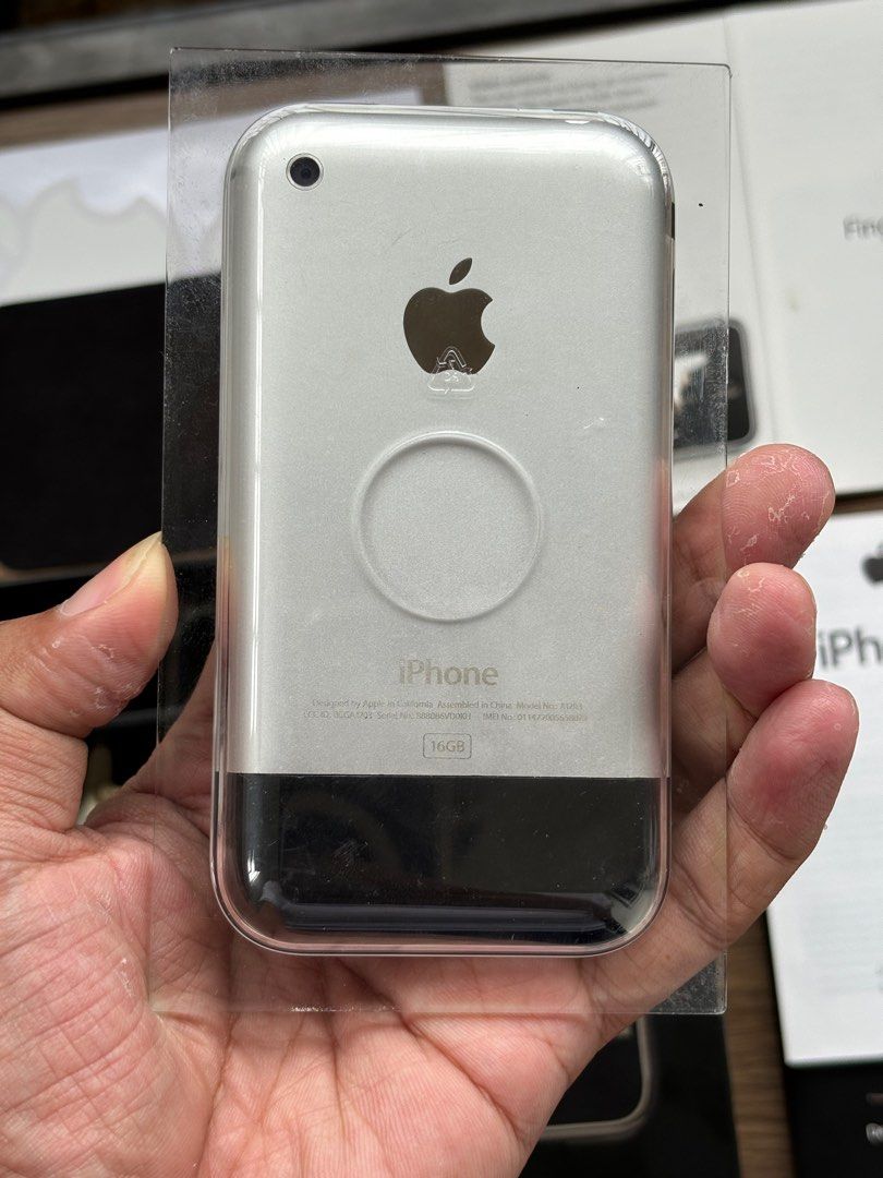 First Generation iPhone 2G Complete Set (Category: Others) located in Lipa City. Submitted by slicksmithtechnology (Listing ID 1332968518, Image 3). Description: The very first iPhone also known as iPhone 2G released back in 2007. Smooth housing and working. With genuine box, manual, charging cable, dock, polishing cloth, apple sticker, and manuals. This is a collector and technology enthusiasts dream. Please note that sealed iPhone 2G is between