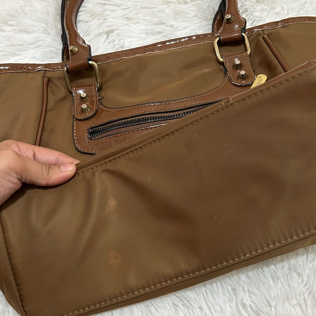 JOVANNI BROWN SHOULDER BAG (Category: Luxury Bags & Wallets) located in Naga. Submitted by starlightbyalli (Listing ID 1333052320, Image 3). Description: Brown Jovanni Bag Measurements: Drop: 7” Height: 10” Width: 15” Depth: 4” Flaw/s: - has small scratch sa may right front part - needs wash lang since nastock (not really dirty) MOP: Gcash/Bank transfer MOD: J&T/Flash .