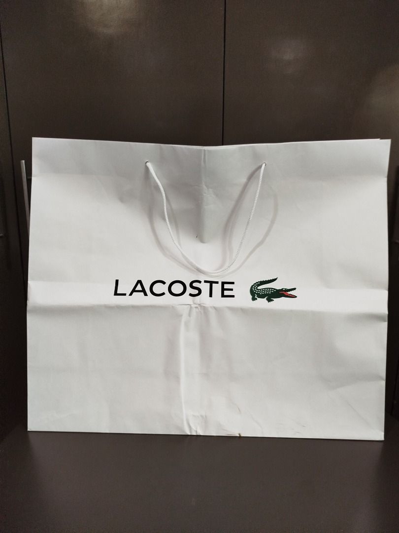 Original Lacoste paper bag XL (Category: Luxury Bags & Wallets) located in Valenzuela. Submitted by cletini (Listing ID 1333091644, Image 1). Description: There is slight dirt stain in a portion and was folded when stored. WYSIWYG Please manage expectations. Posted issues also and size. Item location: Valenzuela 241027 MRWI .