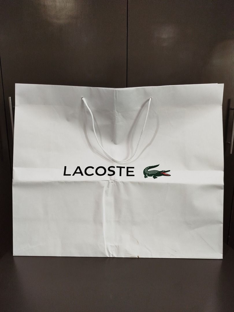Original Lacoste paper bag XL (Category: Luxury Bags & Wallets) located in Valenzuela. Submitted by cletini (Listing ID 1333091644, Image 2). Description: There is slight dirt stain in a portion and was folded when stored. WYSIWYG Please manage expectations. Posted issues also and size. Item location: Valenzuela 241027 MRWI .