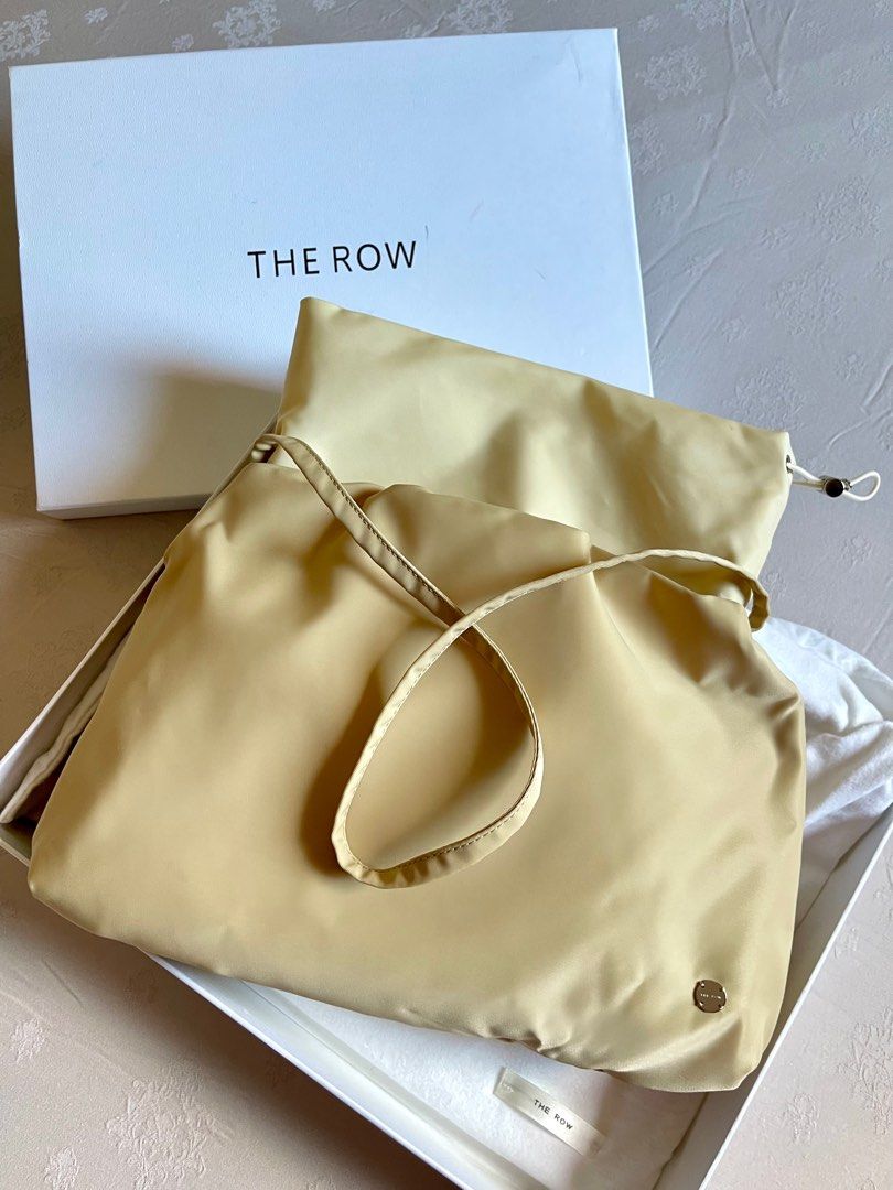 The Row Shoulder Bag in fabric (beige colour) (Category: Bags & Wallets) located in Singapore. Submitted by ooctxx (Listing ID 1333072894, Image 1). Description: The brand term as “quiet luxury” This luxury label was found in 2006 by American actresses Ashley Olsen and Mary-Kate Olsen. Size measurement : 33x26x3 cm Drawstring enclosure Fabric Beige in colour Comes with The Row box and dustbag Only used once. PM for fast deal price! .