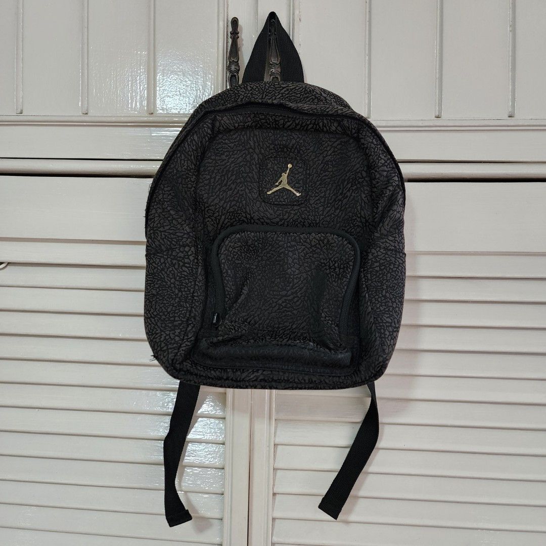 Air Jordan Mini Backpack (Category: Babies & Kids Fashion) located in Quezon City. Submitted by ShopPDplusK (Listing ID 1333170578, Image 1). Description: Brand: Air Jordan Size: Mini Backpack for kids Condition: Fairly used. Zipper pulls are missing but can be replaced at repair shops. RFS: Decluttering. SRP: 2000 PhP Delivery Fees and Pick up arrangements to be made by buyer. (Mira Nila Homes, Quezon City) I only ship to provinces using GoGoX. 