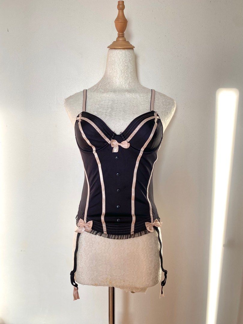 black with pink bow corset (Category: Sleeveless) located in Quezon City. Submitted by emptygrounds (Listing ID 1333210440, Image 1). Description: ✨ size 32B ✨ missing one of the “straps” at the bottom ✨ my absolute favorite corset!! huhu too small on my bust now :(.
