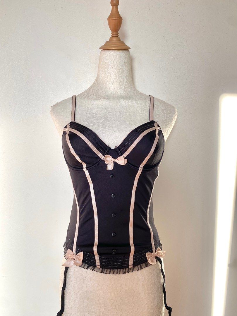 black with pink bow corset (Category: Sleeveless) located in Quezon City. Submitted by emptygrounds (Listing ID 1333210440, Image 2). Description: ✨ size 32B ✨ missing one of the “straps” at the bottom ✨ my absolute favorite corset!! huhu too small on my bust now :(.