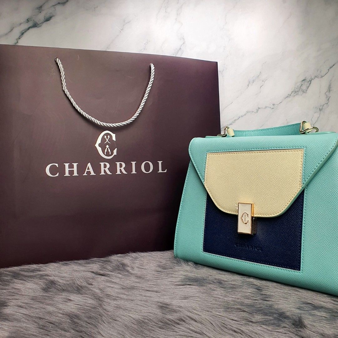 Charriol handbag (Category: Luxury Bags & Wallets) located in Manila. Submitted by cheng23 (Listing ID 1333174027, Image 3). Description: Charriol Le Reve handbag tiffany blue/navy leather comes with dust bag,tag,paper bag dimensions: 20.8x20.5x13.