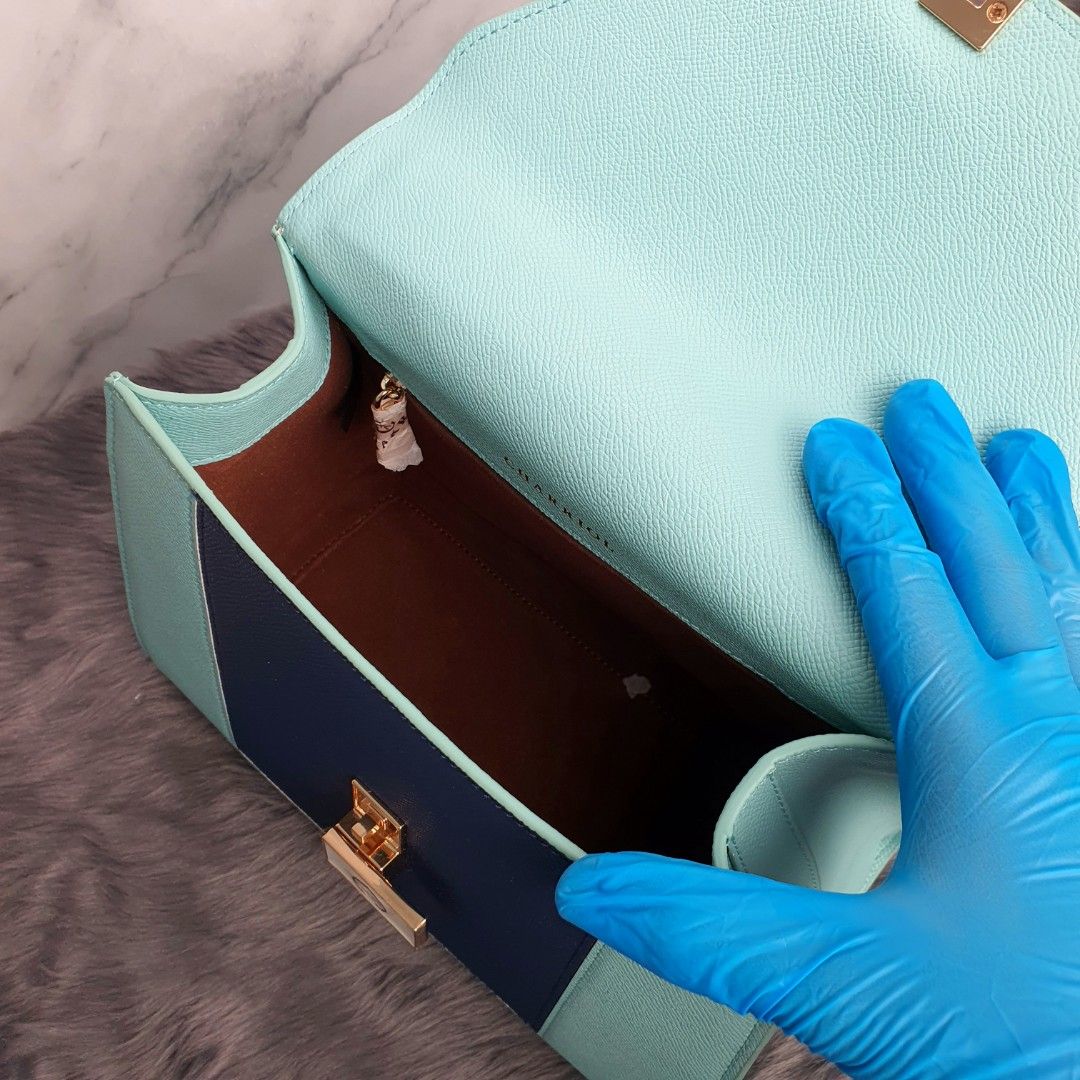 Charriol handbag (Category: Luxury Bags & Wallets) located in Manila. Submitted by cheng23 (Listing ID 1333174027, Image 2). Description: Charriol Le Reve handbag tiffany blue/navy leather comes with dust bag,tag,paper bag dimensions: 20.8x20.5x13.