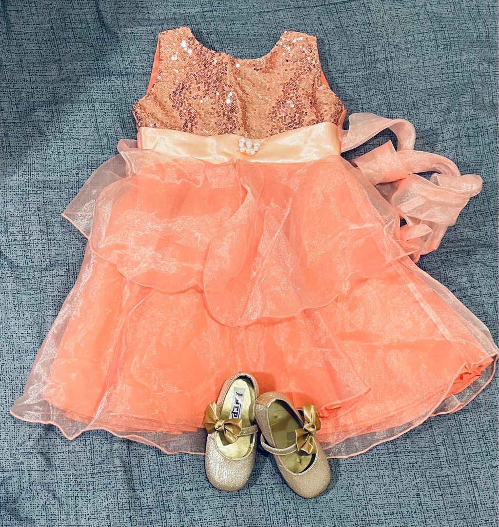 Peach dress and gold shoes shop