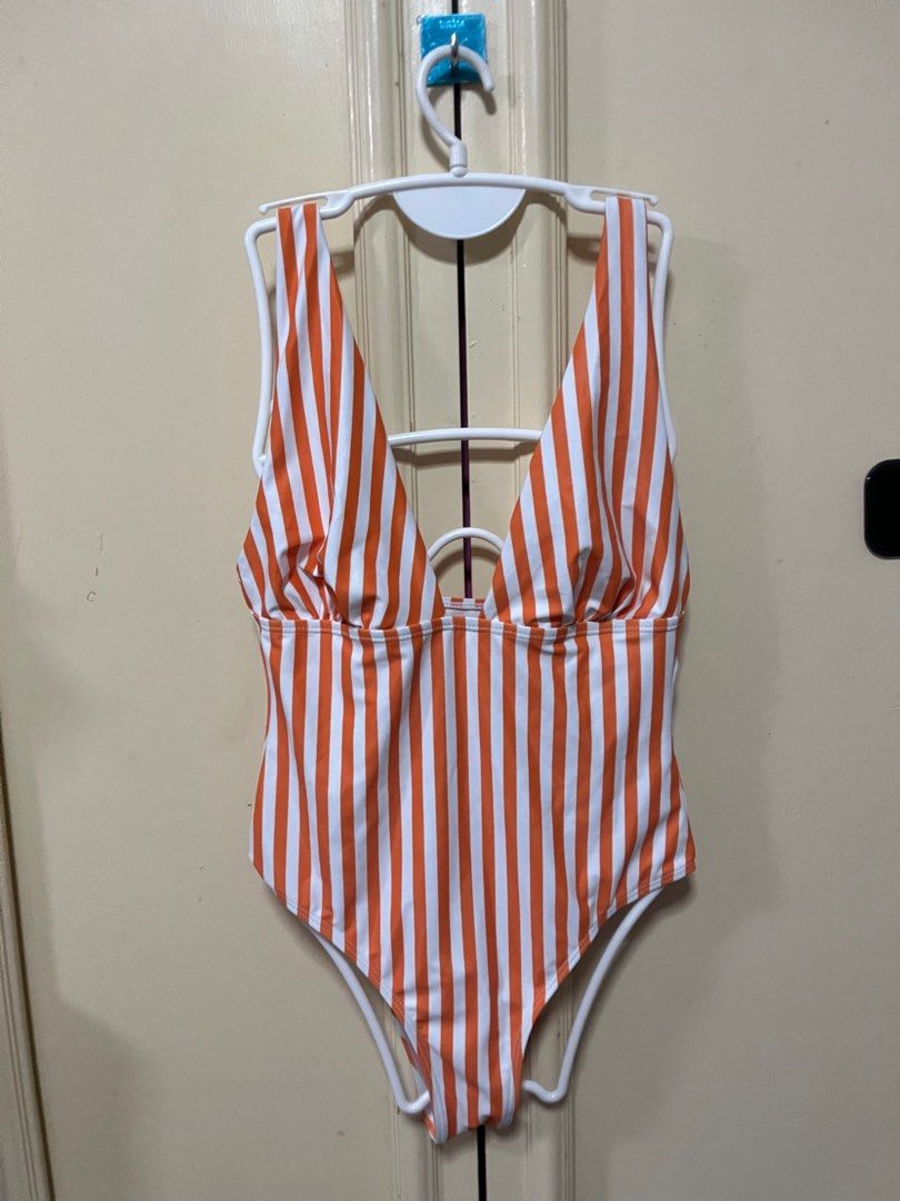 Shein Orange Stripe One Piece (Category: Bikinis & Swimsuits) located in Makati City. Submitted by frelbv (Listing ID 1333196961, Image 1). Description: Never used. No longer fits me Can be bought as 1000 with 3 other items priced 300.