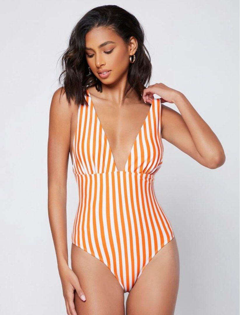 Shein Orange Stripe One Piece (Category: Bikinis & Swimsuits) located in Makati City. Submitted by frelbv (Listing ID 1333196961, Image 3). Description: Never used. No longer fits me Can be bought as 1000 with 3 other items priced 300.