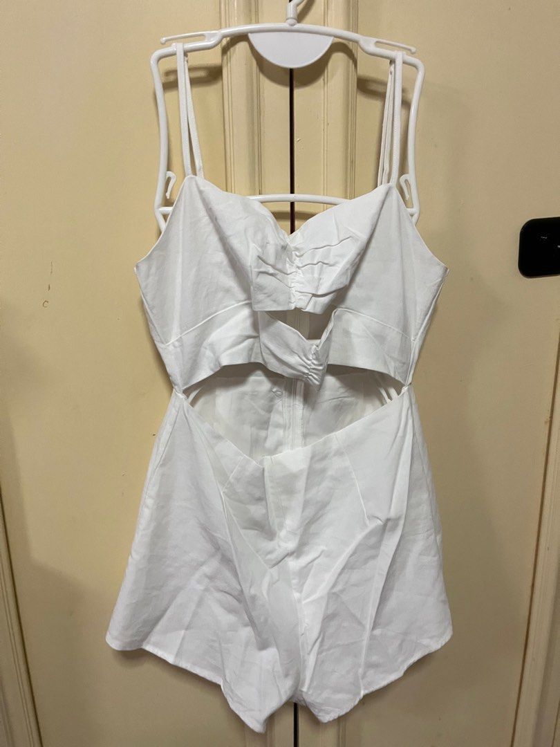White Linen Cut out Romper (Category: Rompers) located in Makati City. Submitted by frelbv (Listing ID 1333195985, Image 1). Description: Used once. No longer fits me Can be bought as 900 with 2 other items priced 350.