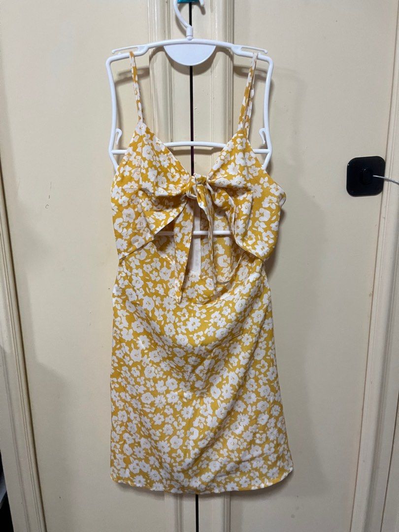 Yellow Front Tie Dress (Category: Dresses) located in Makati City. Submitted by frelbv (Listing ID 1333197899, Image 1). Description: Used once. No longer fits me Can be bought as 900 with 2 other items priced 350.