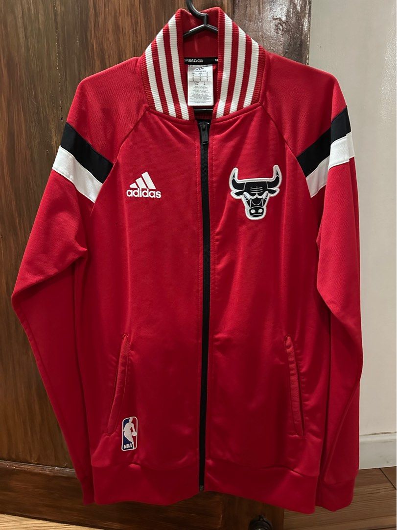 Adidas Red Chicago Bulls Jacket Authentic (Category: Coats, Jackets and Outerwear) located in Paranaque City. Submitted by syntaxcode (Listing ID 1333472171, Image 1). Description: Adidas Red Chicago Bulls Jacket Authentic jacket from Adidas , bought in SG Looks new. Used twice only. Chest size 14 inches width. Small size Issue-small black dot sa chest part Fixed price 1500. Firm price. Gcash payment. Buyer shoulders the shipping. .