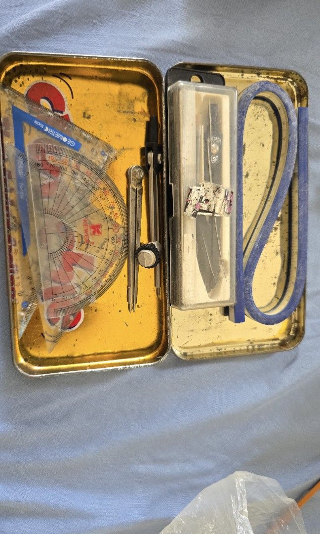 Math set (Category: Stationery & School Supplies) located in Singapore. Submitted by lky1113 (Listing ID 1333386851, Image 1). Description: 1 Protractor 2 Set square 3 compasses (1 mechanical pencil) 1 flexible curve ruler.