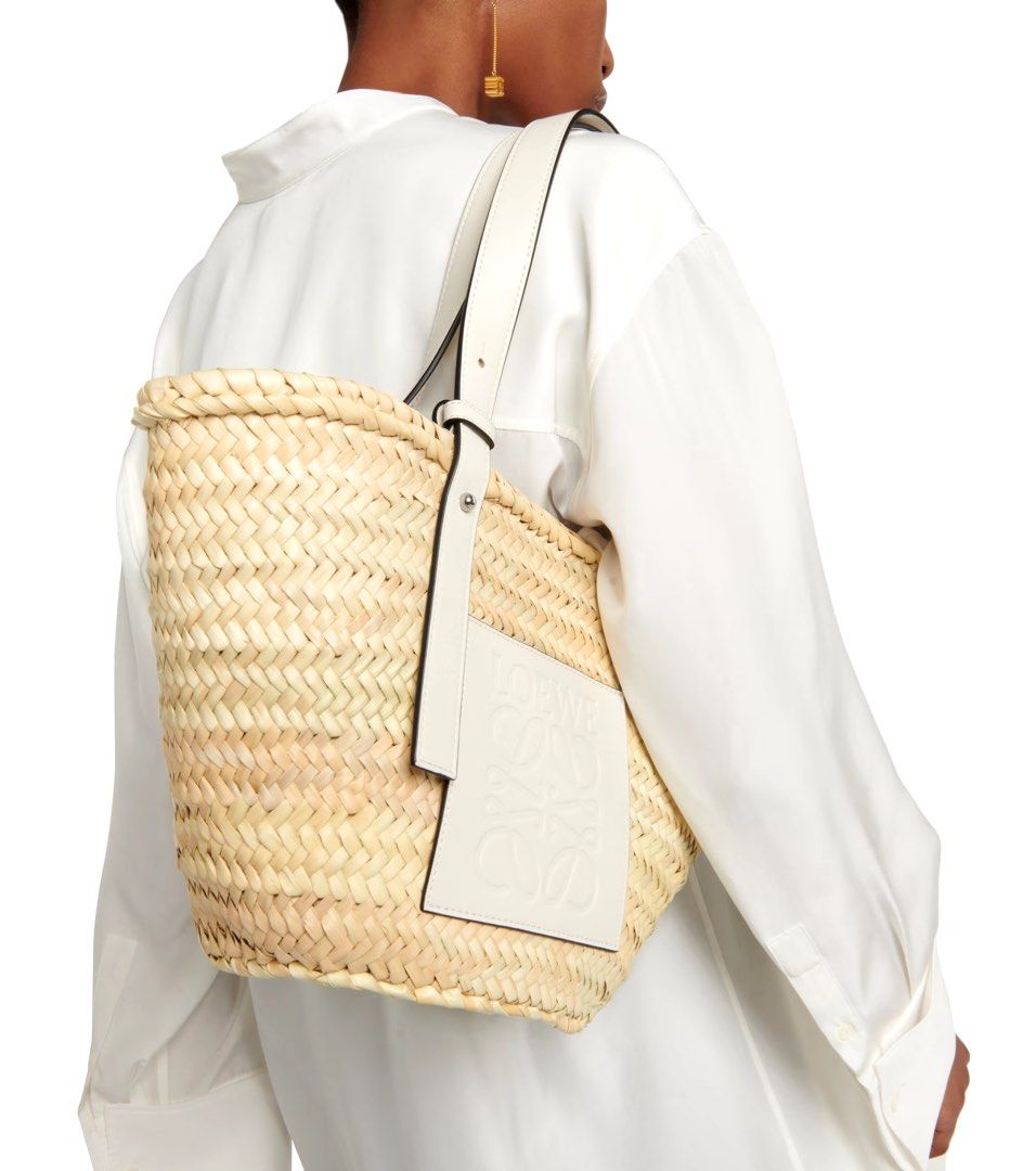 Pasabuy! Loewe Large Raffia Bag in White (Category: Luxury Bags & Wallets) located in Quezon City. Submitted by everybit (Listing ID 1333402697, Image 2). Description: - Brand new and Authentic (Will be bought directly from Stores) - Inclusions: Receipt, Dust Bag, and Tags in tact (I provide everything) - ETA: 4-5 weeks - Only 50% downpayment, remaining will be settled once item is in PH - Super steal price! Note: All of the items posted are subj