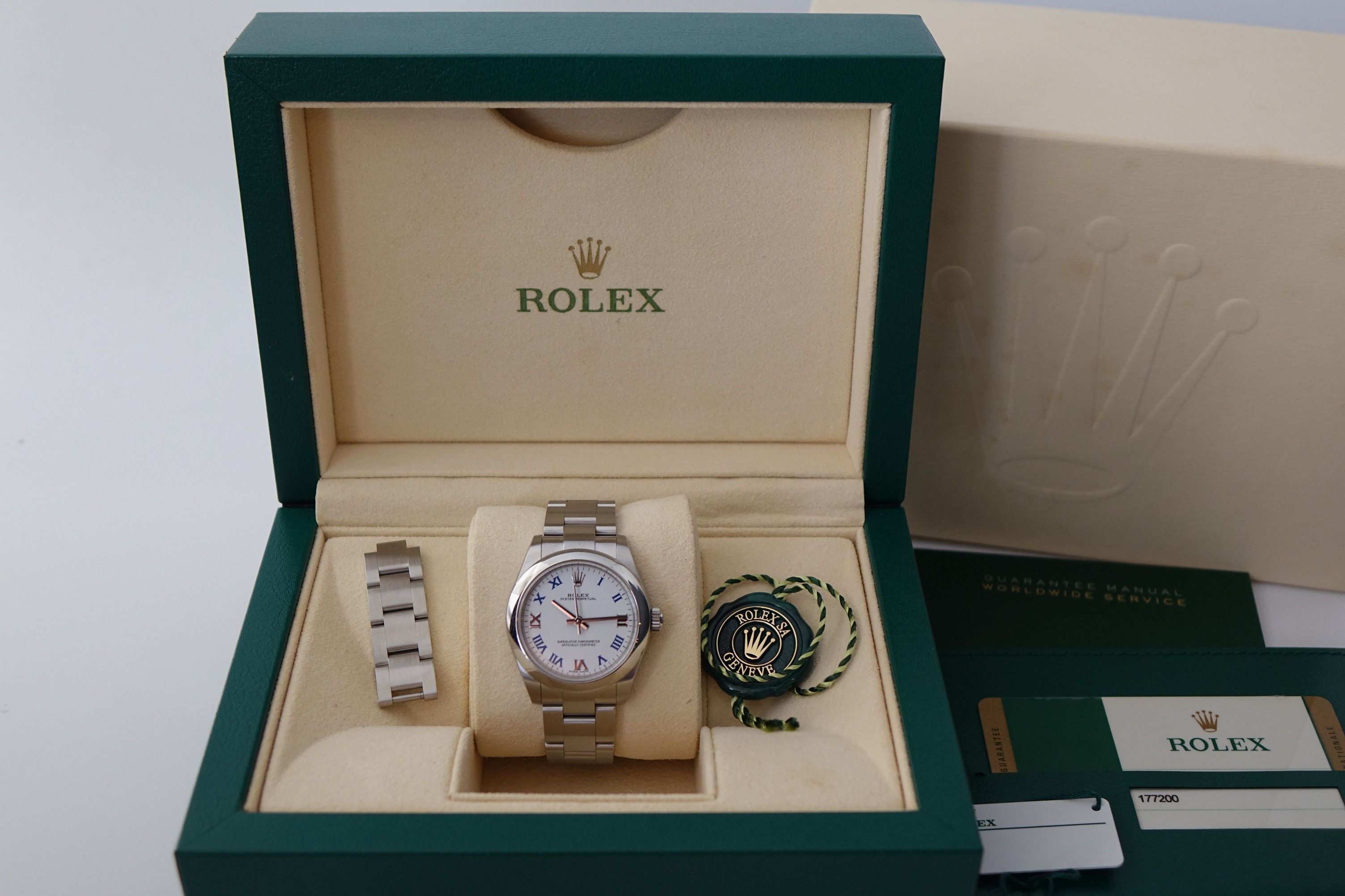 Rolex Oyster Perpetual 31 177200-0016 White Roman full set (Category: Watches) located in Singapore. Submitted by wristime (Listing ID 1333467735, Image 3). Description: Join our tele channel for the latest updates and exclusive deals! t.me/wristime Discontinued model in Pristine Condition. Comes with Box, Papers, Card Holder, Booklet and matching serial tag Brand: Rolex Reference: 177200-0016 Comes with: Box, Papers, Card holder, Booklets, Match