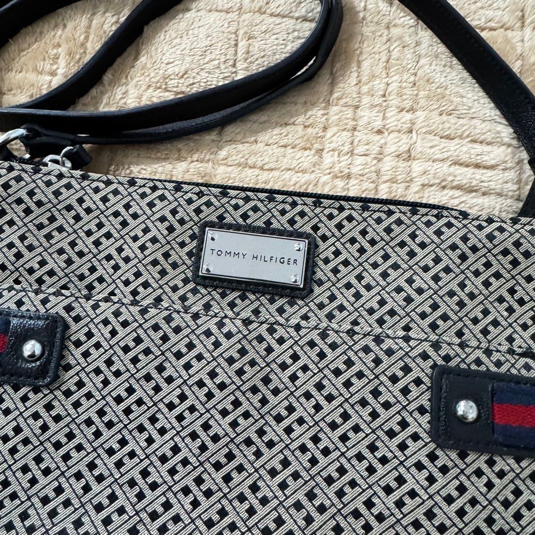 Tommy Hilfiger Crossbody Bag (Category: Cross-body Bags) located in Quezon City. Submitted by arkideclutters (Listing ID 1333442247, Image 2). Description: Canvas Clean interior Few noticeable hairlines on logo Few tarnished hardwares Intact rubber linning on straps and bottom part of the bag.