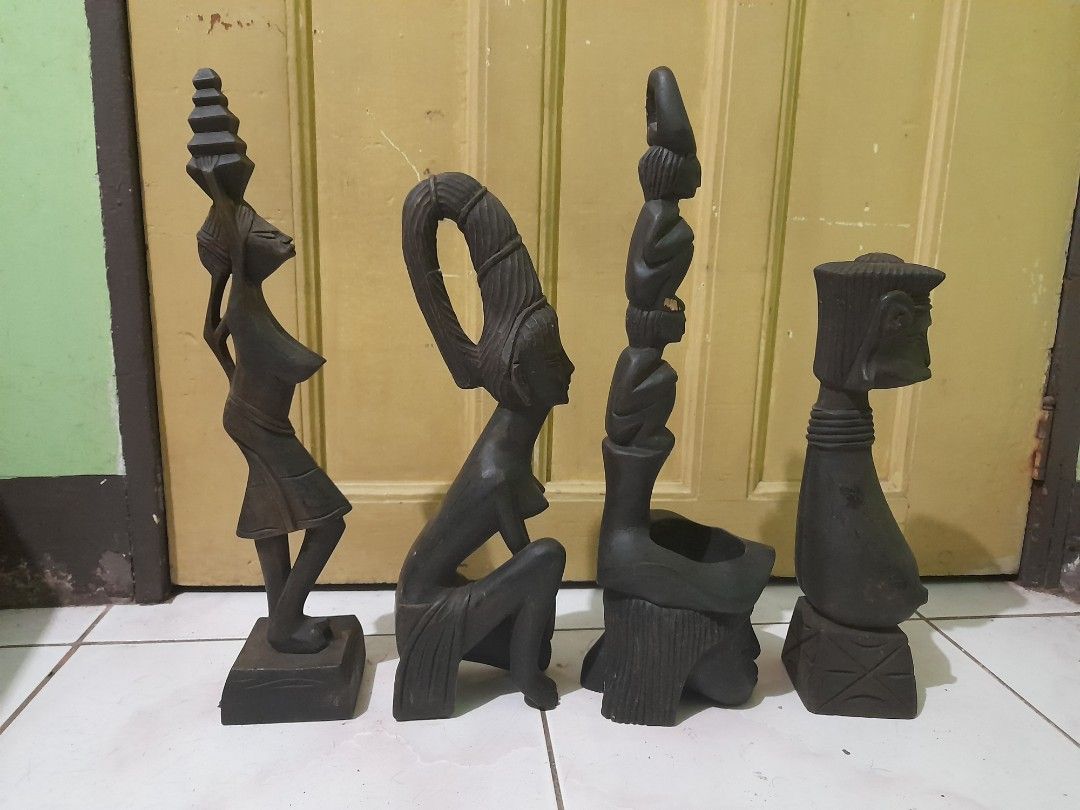 4 wooden tribal figures (Category: Other Home Decor) located in Quezon City. Submitted by verybountiful (Listing ID 1328918390, Image 2). Description: Price for the lot of 4. Has minor imperfections. Pick up in Diliman, Quezon City or by courier on buyer's account and risk. MOP RCBC, Landbank or gcash. No long reservations, please..