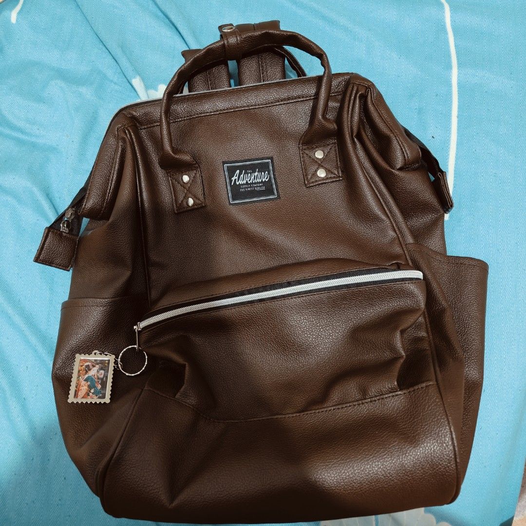 Faux Leather Brown Backpack (Category: Backpacks) located in Bacoor. Submitted by thrifty.reverie (Listing ID 1328929952, Image 1). Description: For decluttering. I got this as a gift from one of my friends. But I prefer my Heartstrings backpack more than this one because it feels less bulky. This backpack is unisex. I just used this a few times, it's sturdy and water resistant so it's nice for backpack travels, halos bago pa. No issues at all..