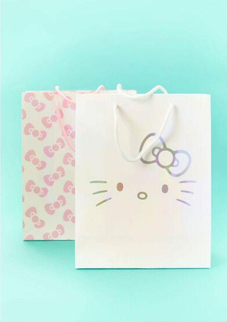 HELLO KITTY GIFT BAG SET (Category: Tote Bags) located in Manila. Submitted by ana_essentials56 (Listing ID 1328788706, Image 1). Description: HELLO KITTY GIFT BAG SET From Hello Kitty x Forever 21 collection, this pack of gift bags features one with a Hello Kitty face design and one with an allover bow print. Size - Width: 10" - Length: 12.5" Orig. Price: P495 Sale Price: P395.