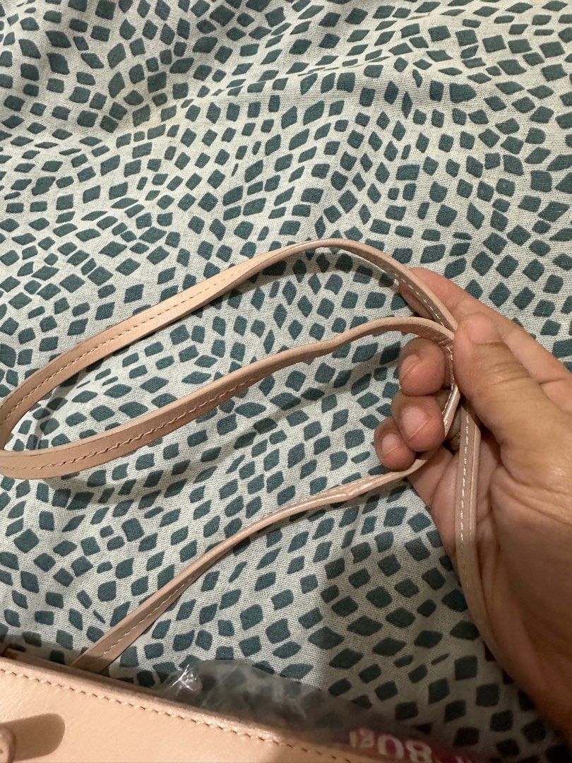 Mansur Gavriel Ocean Tote (Category: Luxury Bags & Wallets) located in Los Banos. Submitted by jeremiah31.3 (Listing ID 1328875970, Image 3). Description: In light peach color and still in very good used condition. Has some scratches and light stains but barely noticeable when worn. A bag with a minimalist yet stylish vibe. A statement bag indeed!.