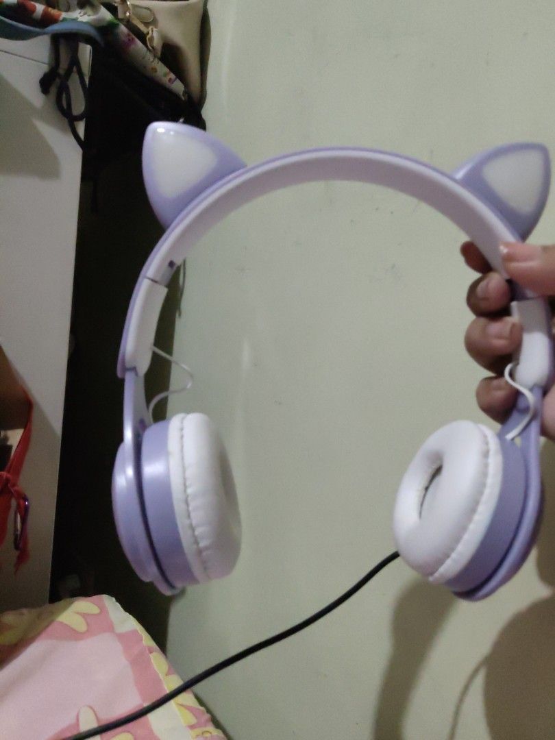 PURPLE kitty ears bluetooth/wireless headphones w/ lights (Category: Headphones & Headsets) located in Quezon City. Submitted by purpleparrot (Listing ID 1328882241, Image 2). Description: purple bluetooth headphones w/ cord lights up (kitty ears) good as new rfs: decluttering.