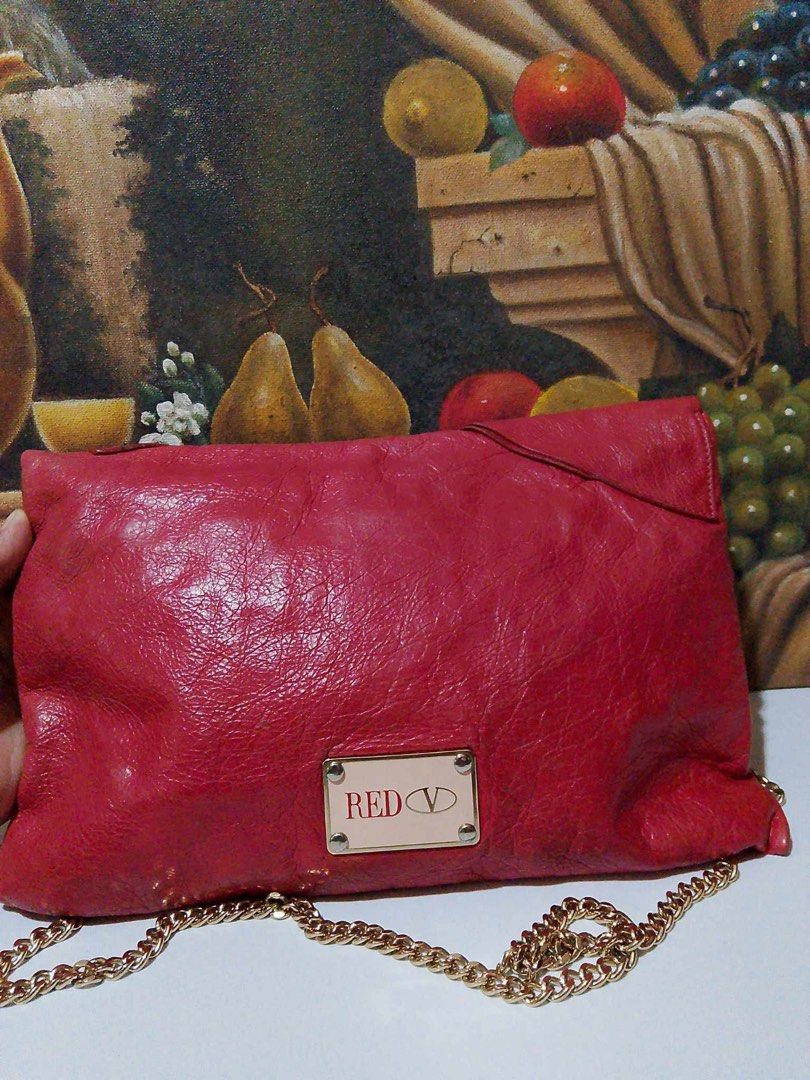 Red Valentino Purse (Category: Luxury Bags & Wallets) located in Muntinlupa City. Submitted by phbudgetluxuryfinds (Listing ID 1328791300, Image 3). Description: Authentic ✅ No damage Gold chain strap (makapal) fabric Interior cleaning required Ready to ship .