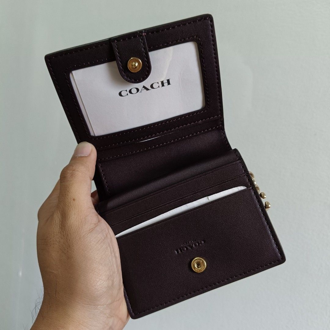 Coach Signature Monogram Print Snap Bifold Wallet CF522 (Category: Luxury Bags & Wallets) located in Manila. Submitted by clarklim (Listing ID 1333585232, Image 3). Description: Coach Signature Monogram Print Snap Bifold Wallet CF522 Teal Rogue Refined pebble leather Length: 4.25" Height: 3.25" Width: 1.0" Outside zip coin pocket Three credit card slots Snap closure Full-length bill compartment ID window 100% Authentic from the US. 🇺🇸 P 10,100.