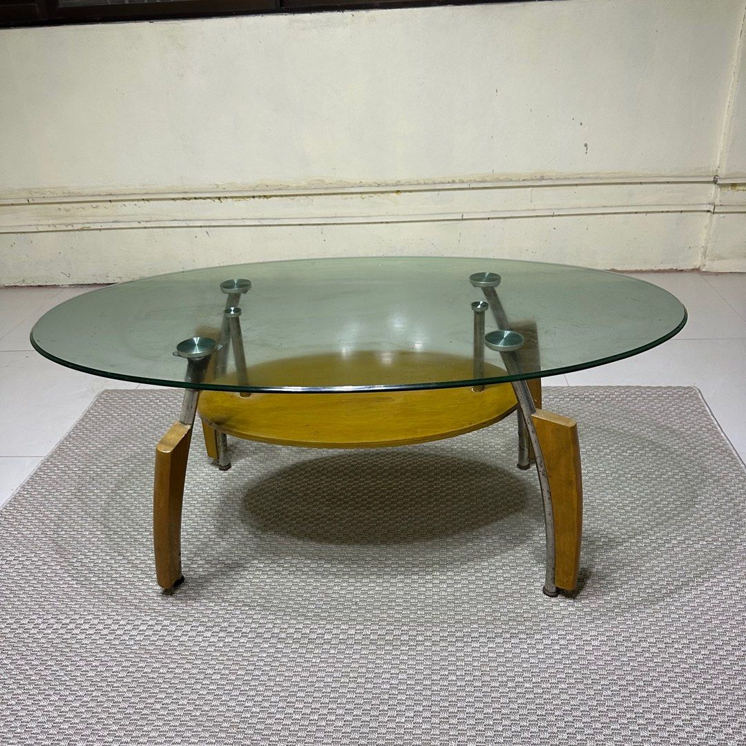 Glass Top Center Table (Category: Tables & Sets) located in Paranaque City. Submitted by shopnsaveph (Listing ID 1333593989, Image 2). Description: Glass-top center table for sale. Has some paint marks but easily removable and some rust. Has good wood accent and very aesthetic. Dimensions are in the pictures posted. Loc: Paranaque Delivery shouldered by buyer..