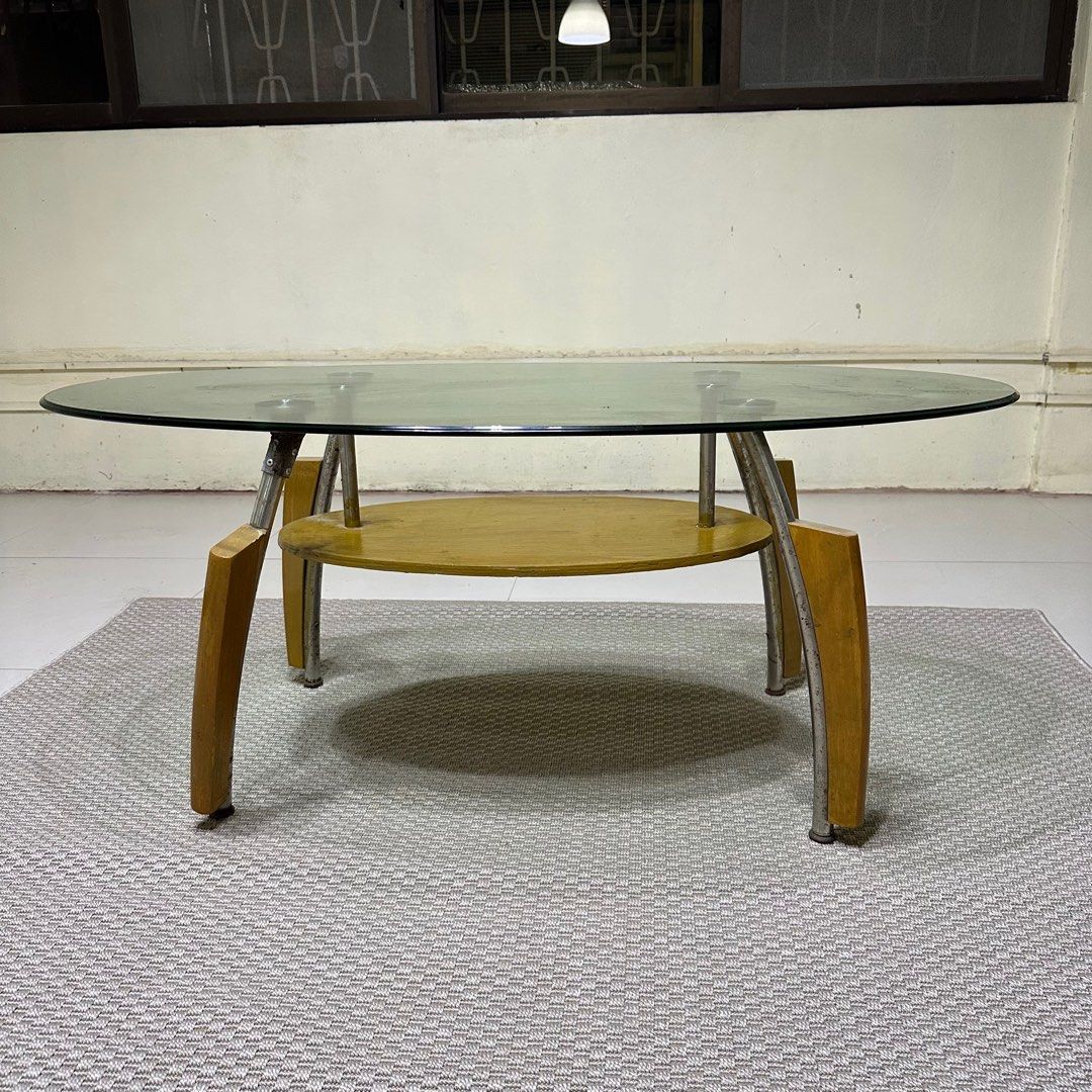 Glass Top Center Table (Category: Tables & Sets) located in Paranaque City. Submitted by shopnsaveph (Listing ID 1333593989, Image 1). Description: Glass-top center table for sale. Has some paint marks but easily removable and some rust. Has good wood accent and very aesthetic. Dimensions are in the pictures posted. Loc: Paranaque Delivery shouldered by buyer..