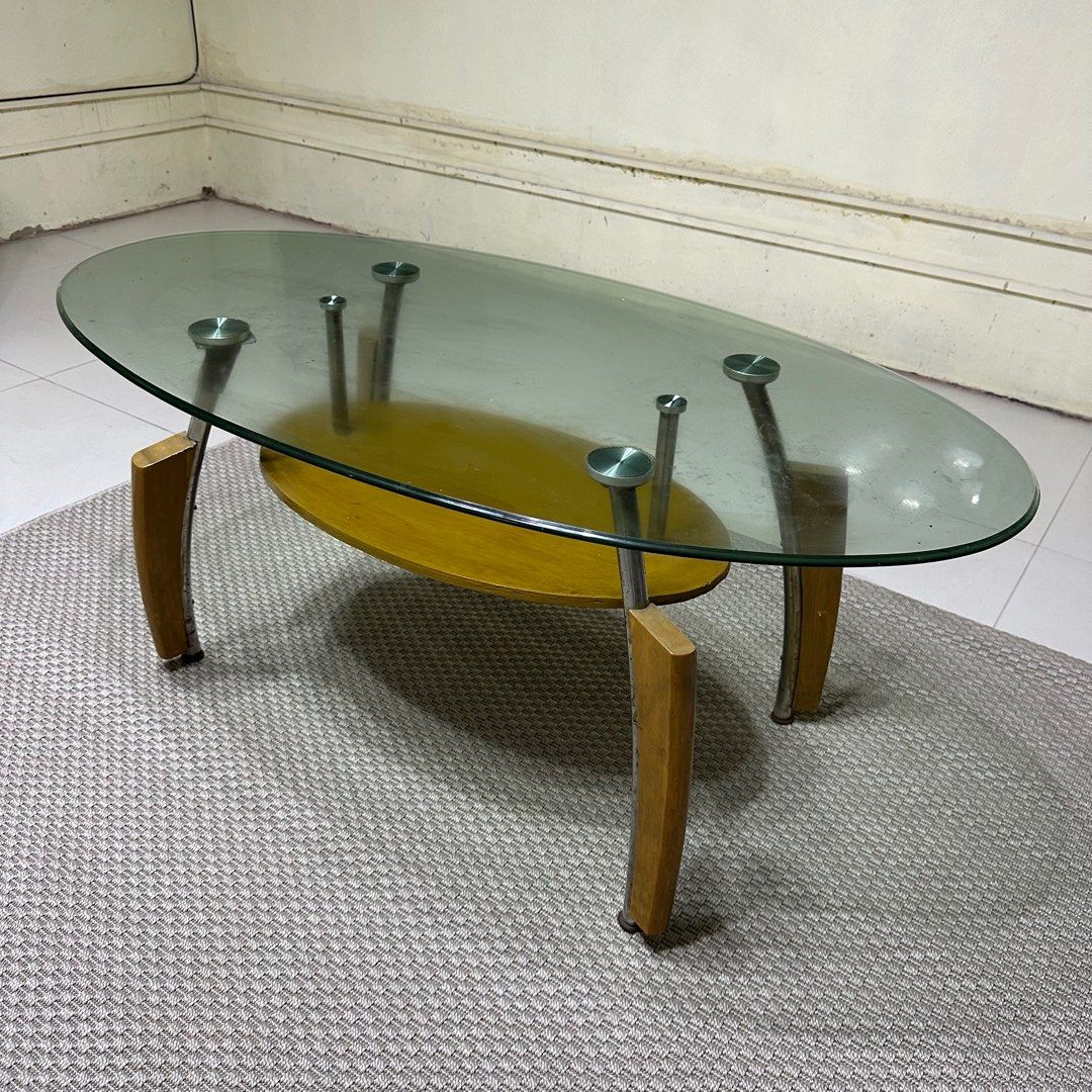 Glass Top Center Table (Category: Tables & Sets) located in Paranaque City. Submitted by shopnsaveph (Listing ID 1333593989, Image 3). Description: Glass-top center table for sale. Has some paint marks but easily removable and some rust. Has good wood accent and very aesthetic. Dimensions are in the pictures posted. Loc: Paranaque Delivery shouldered by buyer..