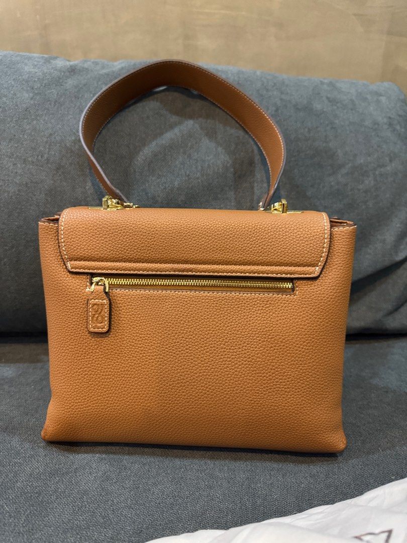 HOLB Clara PU in Brown (Category: Purses & Pouches) located in Manila. Submitted by kasserrano (Listing ID 1333514146, Image 2). Description: Has corner issues but I already painted it with brown paint. I can give the leather paint as a freebie. Overall good condition. Includes 3 straps .