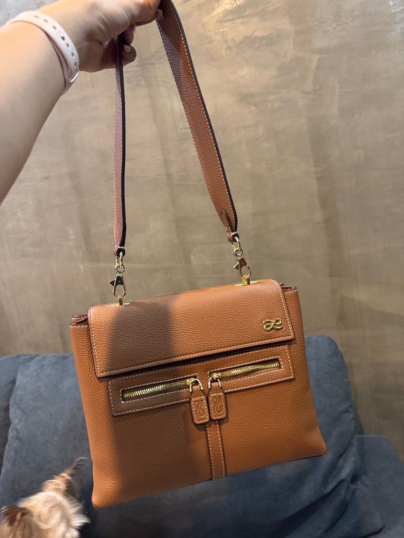 HOLB Clara PU in Brown (Category: Purses & Pouches) located in Manila. Submitted by kasserrano (Listing ID 1333514146, Image 1). Description: Has corner issues but I already painted it with brown paint. I can give the leather paint as a freebie. Overall good condition. Includes 3 straps .