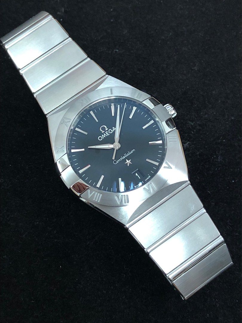 OMEGA Constellation 36mm Black Dial Men's Watch (Category: Luxury Watches) located in Manila. Submitted by luxemax_09 (Listing ID 1333609522, Image 1). Description: Gender: Men’s Reference #: 13110366001001 Year Model: 2020 Movement: Quartz Case Size: 36mm Case Material: Stainless Steel Strap Size: 7.25” / 9” (with face) Crystal: Sapphire Water Resistance: 30m Dial Type/Color: Analog/Black Calendar: Date Display Band Type: Bracelet Band Material: