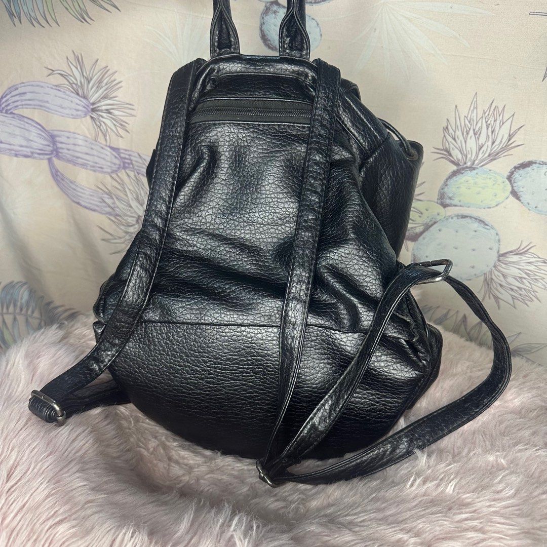 Black leather backpack bag (Category: Backpacks) located in Quezon City. Submitted by jaica.shop (Listing ID 1333727408, Image 2). Description: ✨Not branded ✨ Slightly Negotiable. Just PM your offer ✨ Needs cleaning ✨ Has signs of usage ✨ What you see is what you get ✨ For pick-up or preferred MOD ✨ RFS: Decluttering .