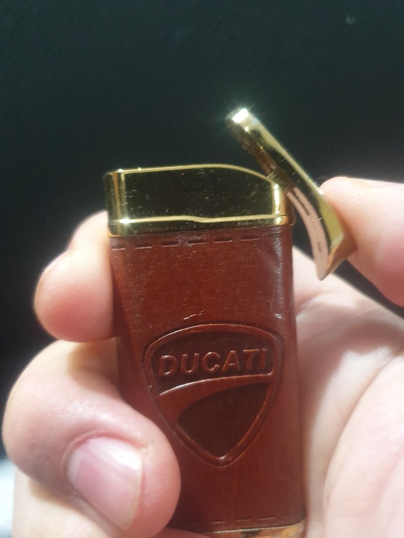 Ducati butane lighter leather gold (Category: Emblem, Sticker and Decals) located in Manila. Submitted by jake.jake6 (Listing ID 1333836898, Image 1). Description: Ducati original butane lighter Gold plates with Leather clad. Works well. Perfect to complete your ducati gear. Too old to ride (no more bike so selling na. Nego a bit. Collectible 4 sure..