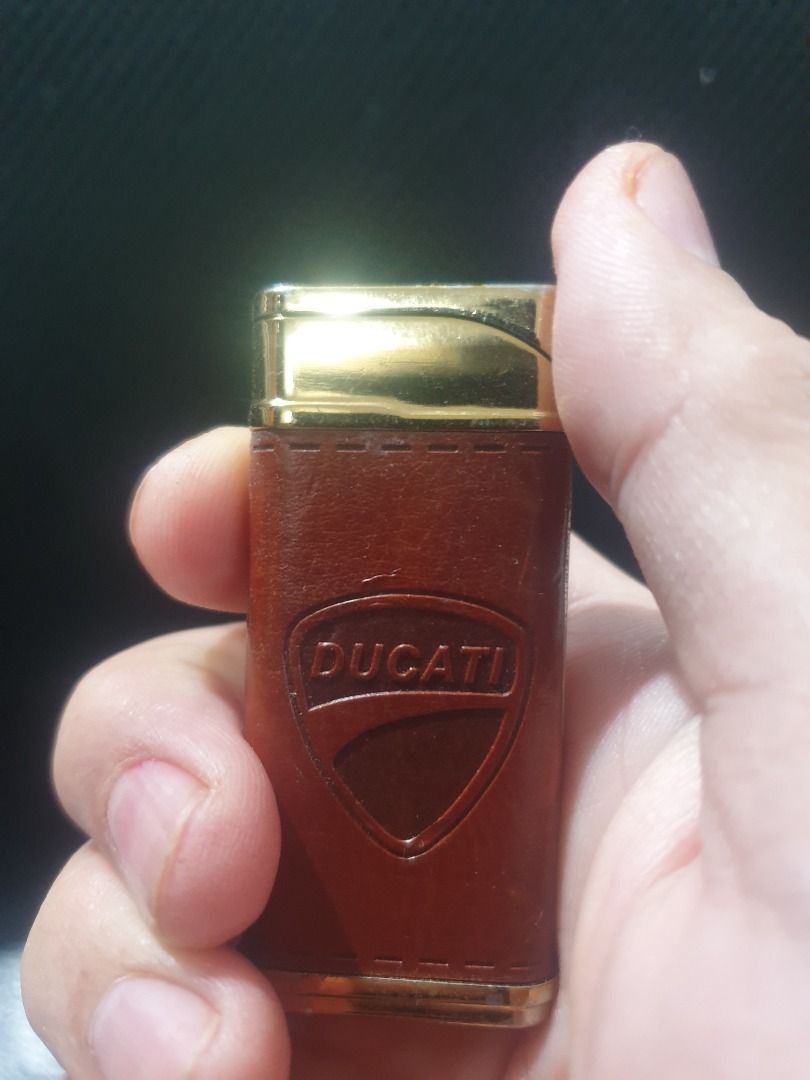 Ducati butane lighter leather gold (Category: Emblem, Sticker and Decals) located in Manila. Submitted by jake.jake6 (Listing ID 1333836898, Image 2). Description: Ducati original butane lighter Gold plates with Leather clad. Works well. Perfect to complete your ducati gear. Too old to ride (no more bike so selling na. Nego a bit. Collectible 4 sure..