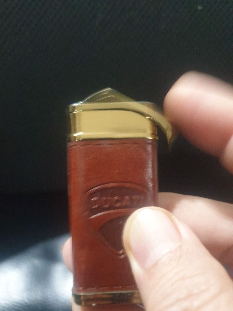 Ducati butane lighter leather gold (Category: Emblem, Sticker and Decals) located in Manila. Submitted by jake.jake6 (Listing ID 1333836898, Image 3). Description: Ducati original butane lighter Gold plates with Leather clad. Works well. Perfect to complete your ducati gear. Too old to ride (no more bike so selling na. Nego a bit. Collectible 4 sure..