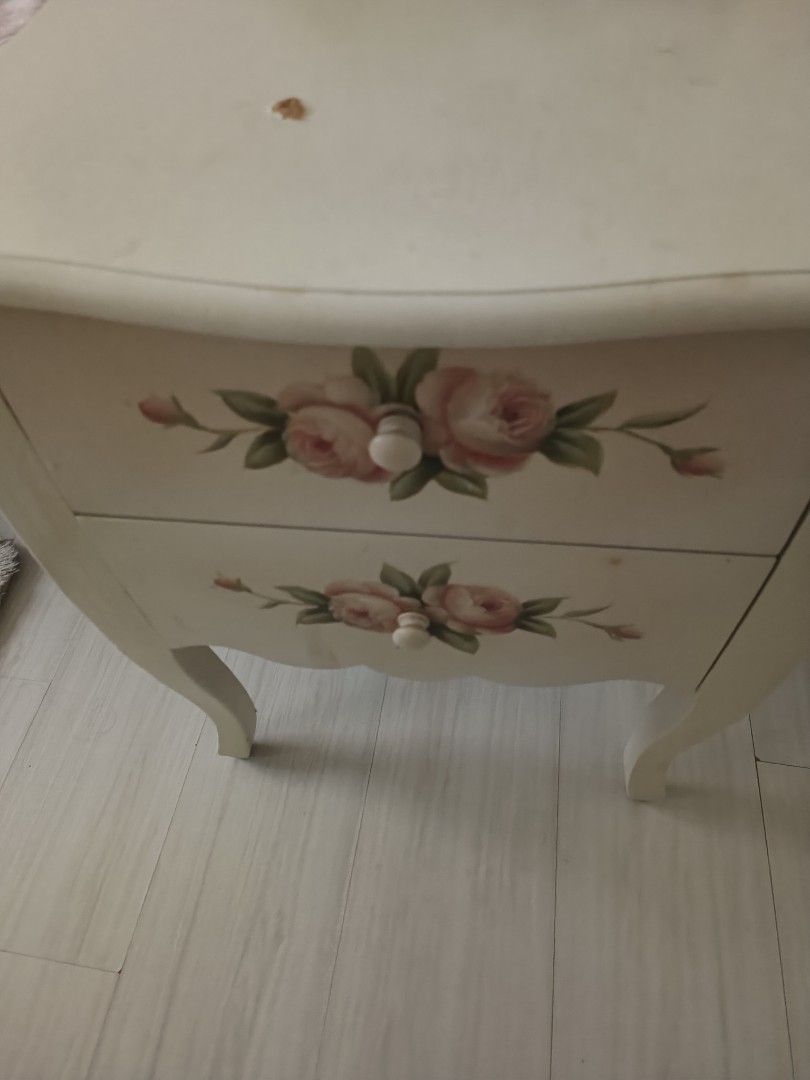 Side table (Category: Other Home Furniture) located in Singapore. Submitted by annuja (Listing ID 1333691632, Image 1). Description: Selling my beautiful side table with rose painting on it. In good condition except for a small scratch on it which can be painted over or covered with a table mat . Selling cheap to clear..
